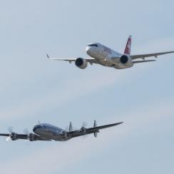 The new C Series landing in Zurich and accompanied by the Lockheed Super Constellation.